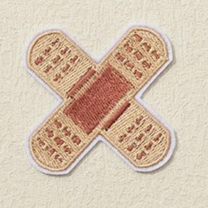May include: A beige fabric patch shaped like a bandage with a red embroidered center. The patch is stitched around the edges with white thread.