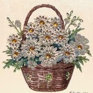 May include: A brown wicker basket filled with white daisies with yellow centers. The daisies are arranged in a bouquet with green leaves.