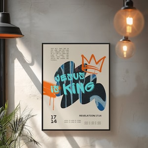 May include: A poster with a graffiti-style design featuring the words "Jesus is King" in blue and orange paint. The poster also includes a crown and the Bible verse Revelation 17:14.