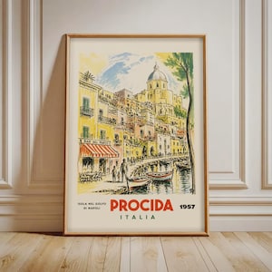 May include: A framed travel poster print featuring a watercolor illustration of Procida, Italy. The scene depicts yellow buildings, a domed church, and boats in a harbor. The text reads: ISOLA NEL GOLFO DI NAPOLI PROCIDA ITALIA 1957.