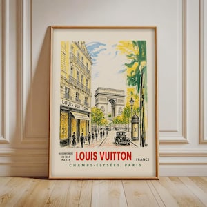 May include: A framed art print featuring a watercolor-style illustration of a Louis Vuitton storefront on the Champs-Élysées in Paris, with the Arc de Triomphe in the background, vintage cars, pedestrians, and the text Louis Vuitton Maison Fondée 1854.