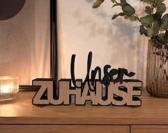 Letrero con la frase "Our Home" y diseño de panel: decoración moderna para el hogar impresa en 3D.