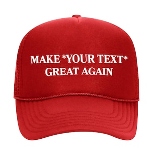 May include: Red trucker hat with white mesh back. The hat has white text that reads "MAKE *YOUR TEXT* GREAT AGAIN".