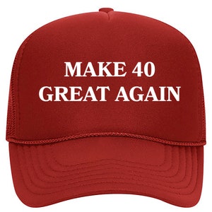 May include: Red trucker hat with white text that reads "MAKE 40 GREAT AGAIN".