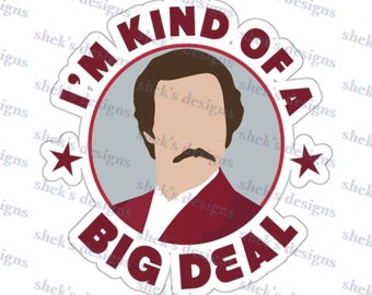May include: A white sticker with a red circle and a white star on each side. Inside the circle is a cartoon illustration of a man with brown hair and a mustache wearing a red jacket. The text "I'm kind of a big deal" is written in red letters around the circle.