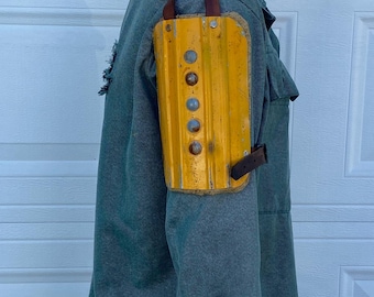 Steel shoulder armor with details.