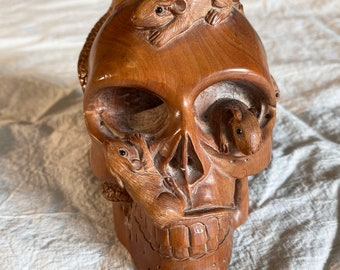 4 inch netsuki style carved wooden skull.