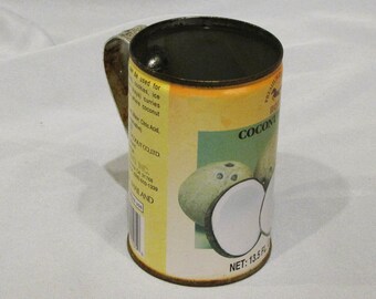 Rusty tin can made into a mug