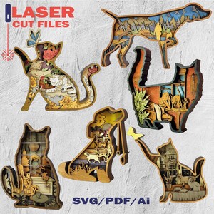 May include: Laser cut files featuring layered wooden art in the shapes of a dog and cats. The cat designs include floral and interior scenes. The dog design depicts a mountain landscape. The text "LASER CUT FILES" and "SVG/PDF/Ai" are also visible.