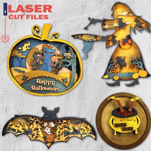 Peut inclure: Décorations d'Halloween découpées au laser. Comprend une citrouille avec un chat, une sorcière, une chauve-souris et un chaudron avec le texte "It's just a bunch of Hocus Pocus". La citrouille porte l'inscription "Happy Halloween".
