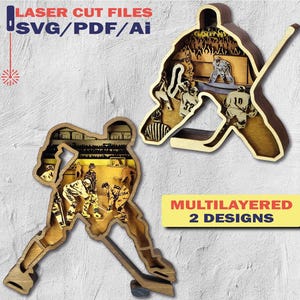 May include: Two wooden, multilayered hockey-themed designs. One depicts a player in action, the other a goalie. The designs are laser cut and feature the text "LASER CUT FILES SVG/PDF/Ai" and "MULTILAYERED 2 DESIGNS".