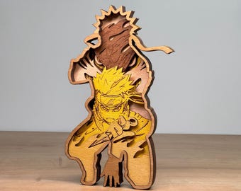 May include: A layered wooden sculpture of an anime character in shades of brown, yellow, and tan. The character is depicted in a dynamic pose, holding a weapon. The sculpture has a detailed, carved design, showcasing the character's features and clothing.