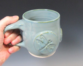 Blue coffee or tea mug with dragonfly design