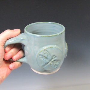 Blue coffee or tea mug with dragonfly design