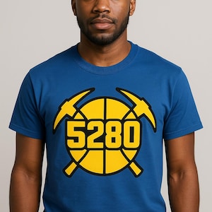 May include: A royal blue t-shirt with a yellow basketball and crossed pickaxes graphic. The number 5280 is printed on the basketball.