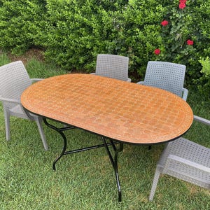 May include: A set of three ceramic nesting bowls in graduating sizes. The bowls feature a speckled, matte finish in shades of cream, light brown, and dark brown. The largest bowl measures approximately 8 inches in diameter.