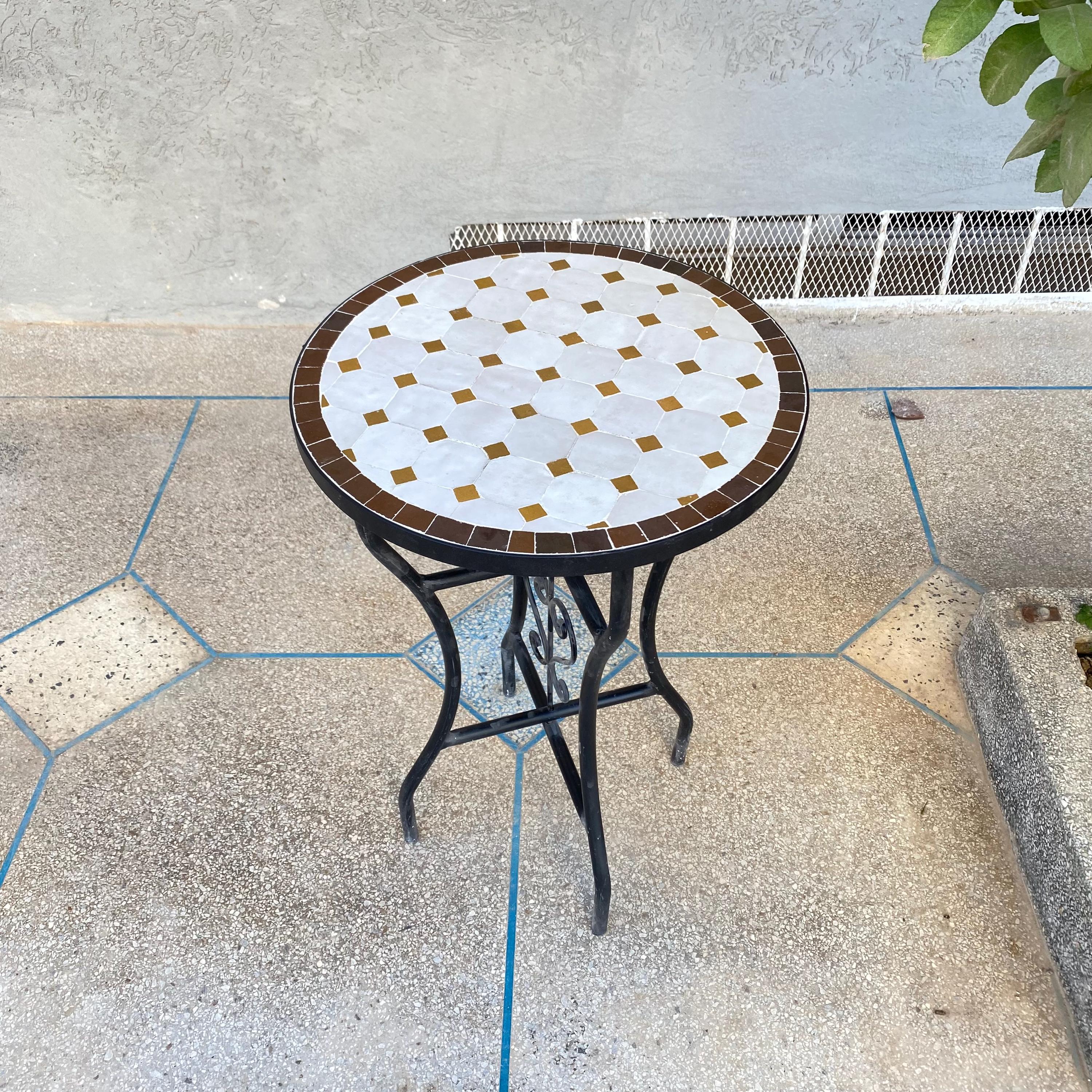 White with golden yellow accents and a dark brown border in a mosaic pattern- Black wrought iron