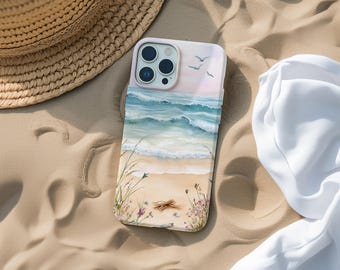 May include: A white phone case with a painted image of a beach scene. The case features blue ocean waves, a sandy beach, and seagulls flying overhead.