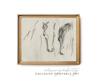 May include: A black and white line drawing of two horses' heads, framed in a gold frame.