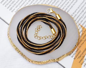 Collar de cuentas negras y doradas: joyería de acero inoxidable hecha a mano