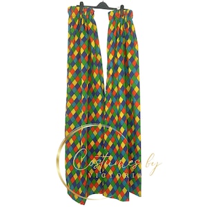 May include: A pair of colorful clown pants with a diamond pattern in red, yellow, blue, and green. The pants are hanging on a black hanger.