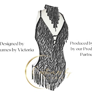May include: Black fringe dance costume with a geometric pattern. Designed by Costumes by Victoria. Produced by Hand by our Production Partner.