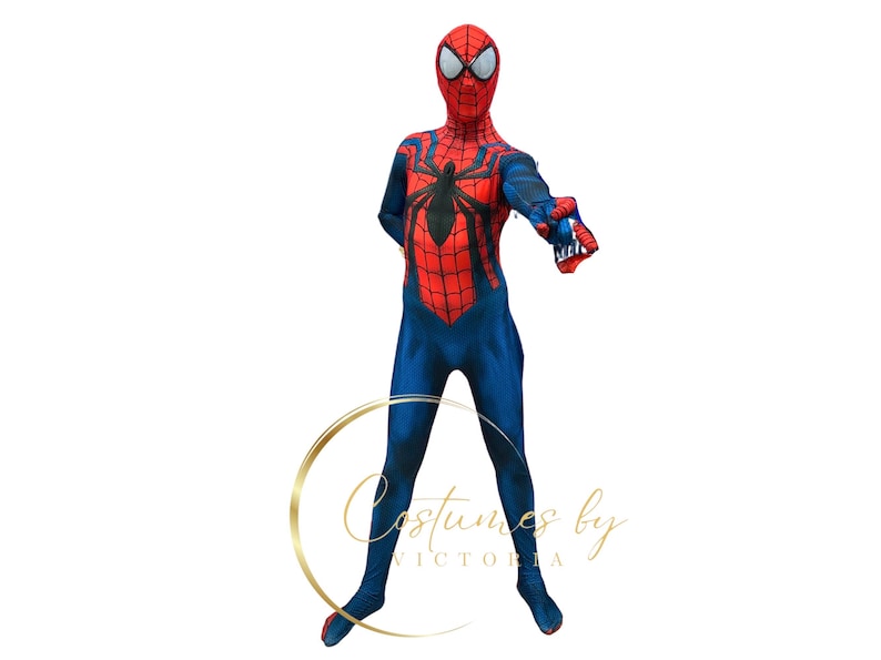 May include: A child wearing a red and blue Spiderman costume with a black spider design on the chest. The costume has a mask with a red and black design.
