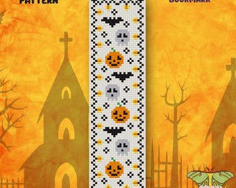 May include: A rectangular cross-stitch pattern for a Halloween bookmark featuring a white background with a black border. The design includes repeating motifs of orange jack-o'-lanterns, grey skulls, black bats, and small yellow stars.
