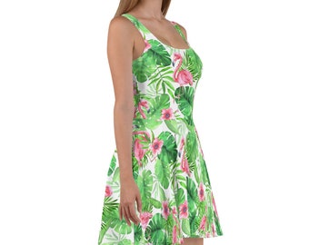 May include: A white skater dress with a tropical print featuring pink flamingos, green leaves, and pink flowers.