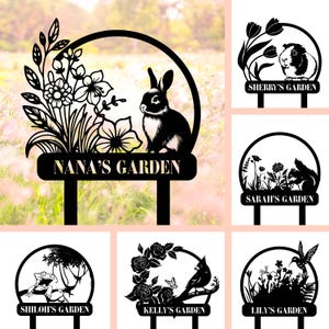May include: Set of 6 black metal garden stakes with different animal and floral designs. Each stake has a personalised nameplate with the text "Nana's Garden", "Sherry's Garden", "Sarah's Garden", "Shiloh's Garden", "Kelly's Garden", and "Lily's Garden".