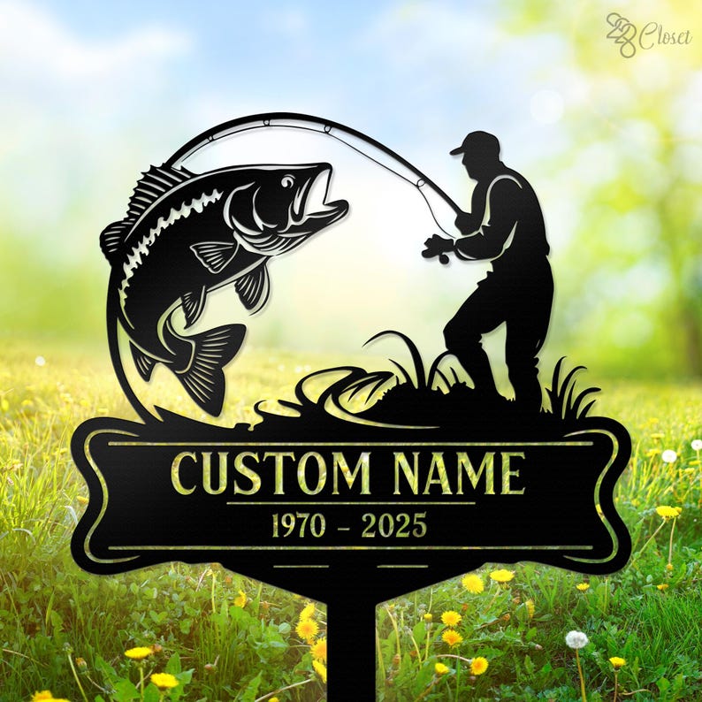 May include: Black metal silhouette of a fisherman holding a fishing rod with a large fish jumping out of the water. The sign has a black banner with the text "CUSTOM NAME 1970 - 2025".