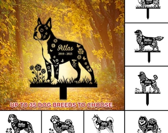 May include: Black metal dog memorial stake featuring a Boston Terrier silhouette with the name "Atlas" and dates "2010-2025", adorned with floral and butterfly cutouts. The stake is set in a grassy base with flowers. Text reads "UP TO 35 DOG BREEDS TO CHOOSE".
