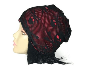 May include: Black beanie with a skull pattern and a red mesh lining.