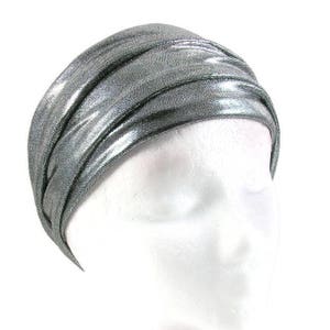 May include: A silver metallic turban headband with a shiny finish.