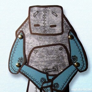 May include: A gray robot with blue arms and gold accents. The robot has a simple face with two eyes and a mouth.