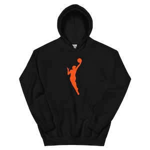 May include: Black hoodie with an orange silhouette of a basketball player shooting a basketball.