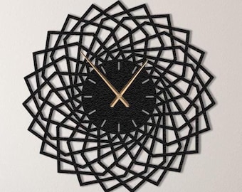 Puede incluir: Un reloj de pared geométrico negro y dorado con un diseño de mandala. El reloj tiene una esfera negra con agujas doradas y un marco negro.