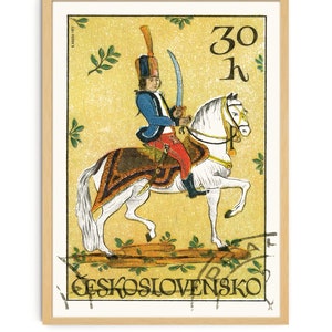 May include: A vintage Czechoslovakian postage stamp featuring a colorful illustration of a soldier on horseback. The stamp is yellow with green leaves and the text "30 h" and "CESKOSLOVENSKO".
