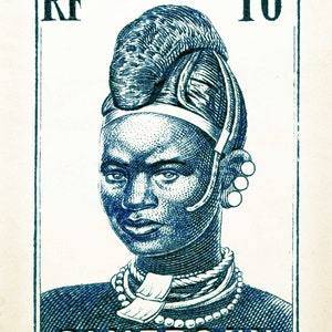 May include: A blue and white stamp with the text "RF POSTES 10c CAMEROUN". The stamp features a portrait of a woman wearing a traditional headdress and jewelry.