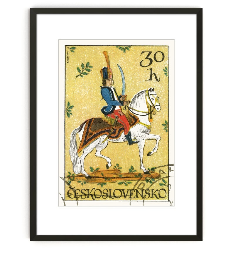 May include: A vintage Czechoslovakian postage stamp featuring a colorful illustration of a soldier on horseback. The stamp is yellow with green accents and reads "30 h" and "CESKOSLOVENSKO".