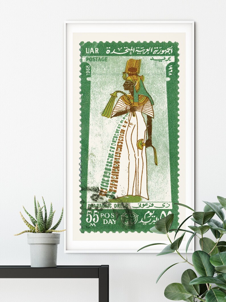 May include: A vintage postage stamp from the United Arab Republic (UAR) featuring a green background and a depiction of an Egyptian pharaoh in a white robe and a gold headdress. The stamp reads "جمهورية العربية المتحدة UAR" and "1968" in Arabic and English. The text "PHARAONIC DRESS" and "5.5 POS DAY" are also visible.