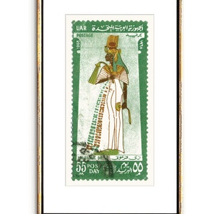 May include: A green postage stamp from the United Arab Republic (UAR) featuring a pharaoh in a traditional dress. The stamp is dated 1968 and has the text "جمهورية العربية المتحدة UAR" and "PRAPAONIC DRESS زی فرعونی" in Arabic.