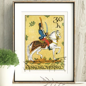 May include: A vintage Czechoslovakian postage stamp featuring a colorful illustration of a soldier on horseback. The stamp is yellow with green leaves and the text "30 h" and "CESKOSLOVENSKO".