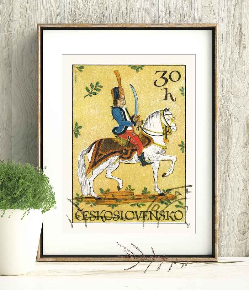 May include: A vintage Czechoslovakian postage stamp featuring a colorful illustration of a soldier on horseback. The stamp is yellow with green leaves and the text "30 h" and "CESKOSLOVENSKO".