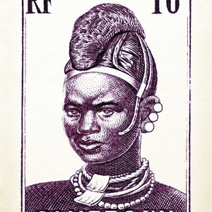 May include: A purple and white stamp with a portrait of a person wearing a beaded necklace and a headdress. The stamp reads "RF POSTES 10c CAMEROUN".