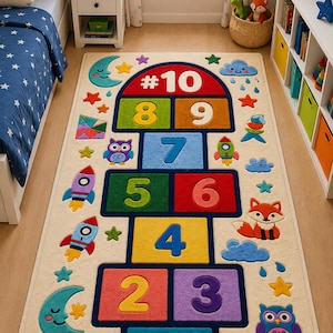 May include: A colorful hopscotch rug with numbers 1 through 10, plus whimsical illustrations of rockets, clouds, stars, and animals. The rug is beige with a dark blue border and is designed for a child's bedroom or playroom.