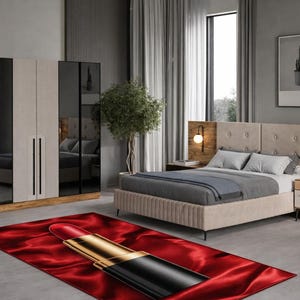May include: A bedroom set featuring a bed with a tufted headboard, nightstands, and a large wardrobe with mirrored doors. A red rug with a lipstick design is in the foreground. The room has neutral tones and modern decor.