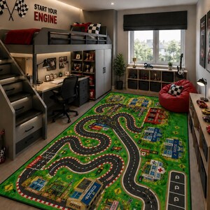 May include: A rectangular area rug featuring a vibrant green landscape with a winding black asphalt road, printed city buildings, a car wash, a finish line, and parking spaces. The rug is designed with a detailed race track pattern.
