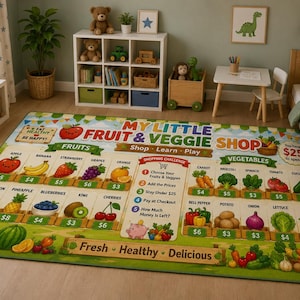 May include: A rectangular area rug featuring a colorful educational design titled My Little Fruit & Veggie Shop. The rug displays various fruits and vegetables with prices, a shopping challenge list, and the text Fresh, Healthy, Delicious.