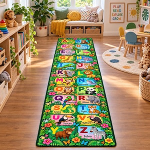 May include: A rectangular runner rug featuring a vibrant green border with tropical flowers and leaves. The center displays the alphabet from A to Z, with each letter paired with a colorful animal illustration and its corresponding name.